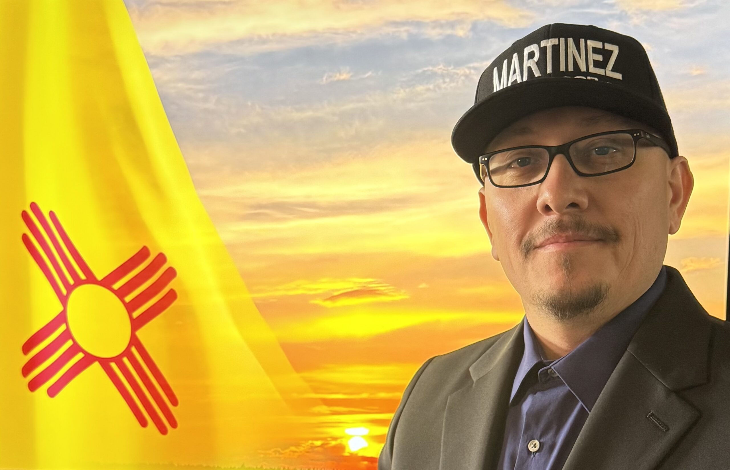 Martinez pictured with the New Mexico state flag
